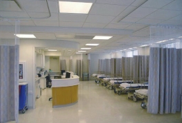 The patient treatment area at the Endoscopy Surgery Centre of Maryland, showing nurses' station, beds, and curtained dividers