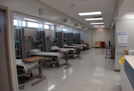 The procedure area at the surgery center, showing patient beds, dividing curtains, and various monitoring devices