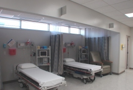 A patient examination area with two beds